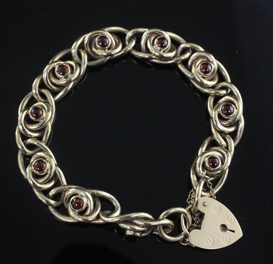 A 9ct gold and cabochon garnet set bracelet,